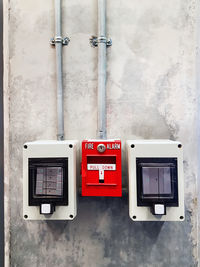 Close-up of telephone booth on wall