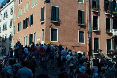 People standing in front of residential building