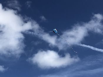 Low angle view of airshow against sky