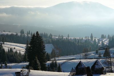 Scenic view of mountains against sky during winter