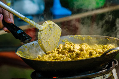 Close-up of person preparing food