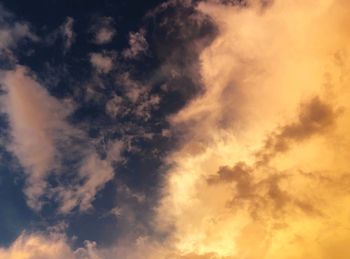 Low angle view of dramatic sky during sunset