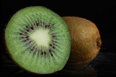 Close-up of halved kiwi on table