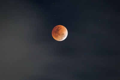 Low angle view of moon against sky at night