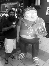 Portrait of man standing in restaurant