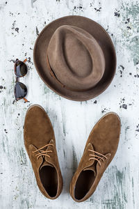 High angle view of shoes and hat on table