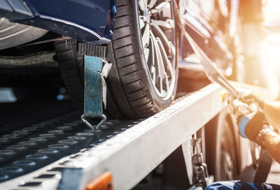 Cropped hand of man repairing car