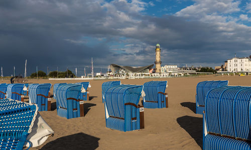 View of beach against cloudy sky