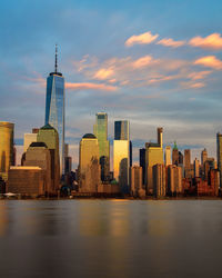 View of modern buildings against sky during sunset