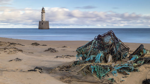 Rattray head lighthouse long exposure with marine rubbish in the foreground