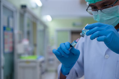 Midsection of person working