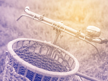 Close-up of bicycle parked on field