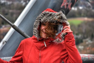 Portrait of man with red umbrella