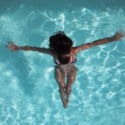 High angle view of woman swimming in pool