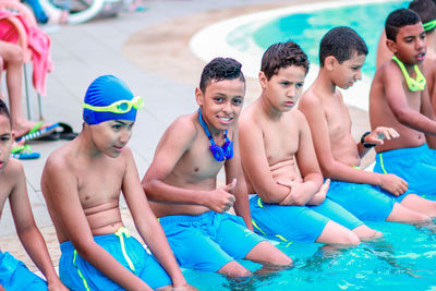 Group of people swimming in pool