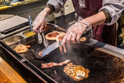 Cooking pan on barbecue grill in kitchen