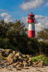 Lighthouse on the baltic sea with an overcast sky.