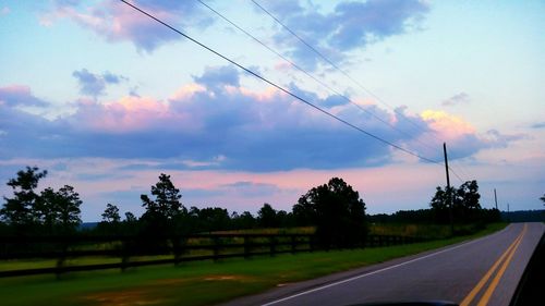 Panoramic view of trees against sky at sunset