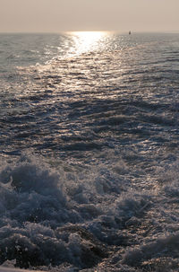 Scenic view of sea against sky at sunset