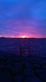 Scenic view of sea against sky at sunset