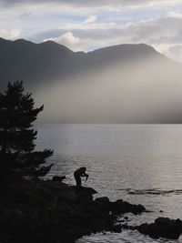 Scenic view of sea against cloudy sky