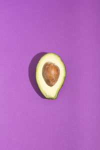Close-up of lemon slice against purple background