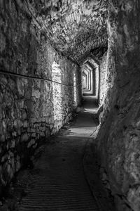 Narrow corridor along old building