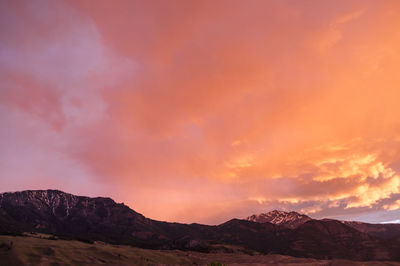 Scenic view of mountain against cloudy sky