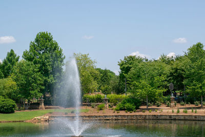 Scenic view of waterfall against sky