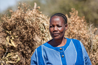 Portrait of woman standing outdoors