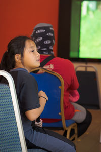 Cute girl sitting at classroom