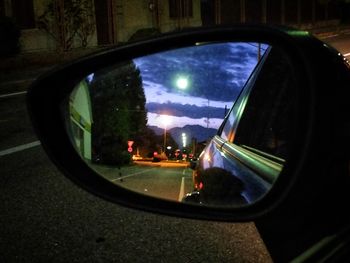 Reflection of car on side-view mirror