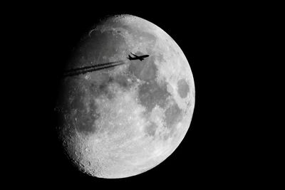 Low angle view of moon against sky at night