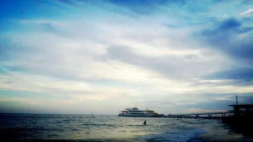 Scenic view of sea against cloudy sky