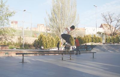 Full length of man skateboarding at park