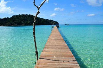 Pier over sea against sky