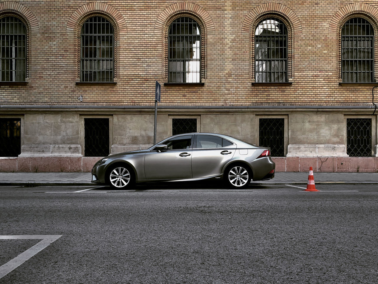 DIGITAL COMPOSITE IMAGE OF CAR ON STREET AGAINST BUILDING