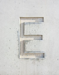Close-up of letter e on white wall