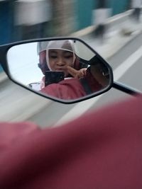 Reflection of woman in sunglasses