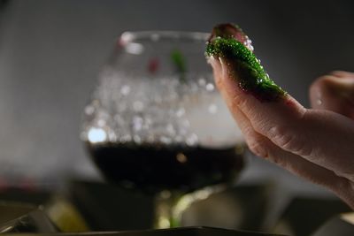 Close-up of hand holding drink