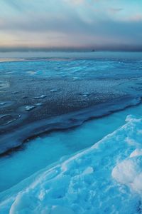 Scenic view of frozen sea against sky