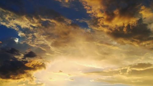 Low angle view of dramatic sky during sunset