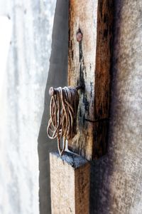 A rubber band hanging on a rusty nail - photo taken from the side