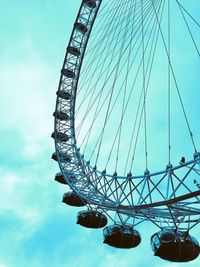 Low angle view of ferris wheel against sky