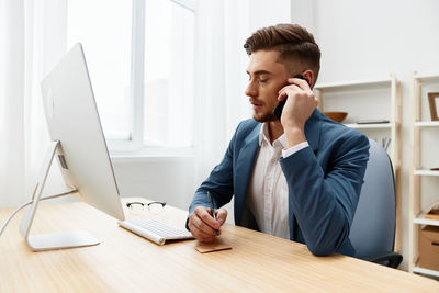 Businesswoman working at desk in office