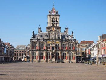 View of buildings in city against clear sky