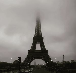 Low angle view of tower against cloudy sky