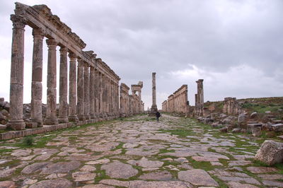 View of old ruin building against cloudy sky