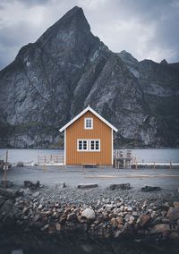 View of building and mountains against sky