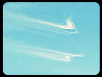 Close-up of vapor trail against blue sky